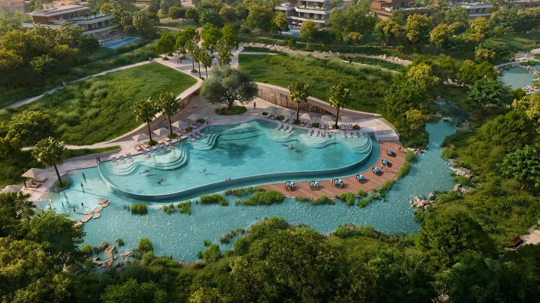 Aerial view of the organic lagoon pool and landscaped park at The Wilds.