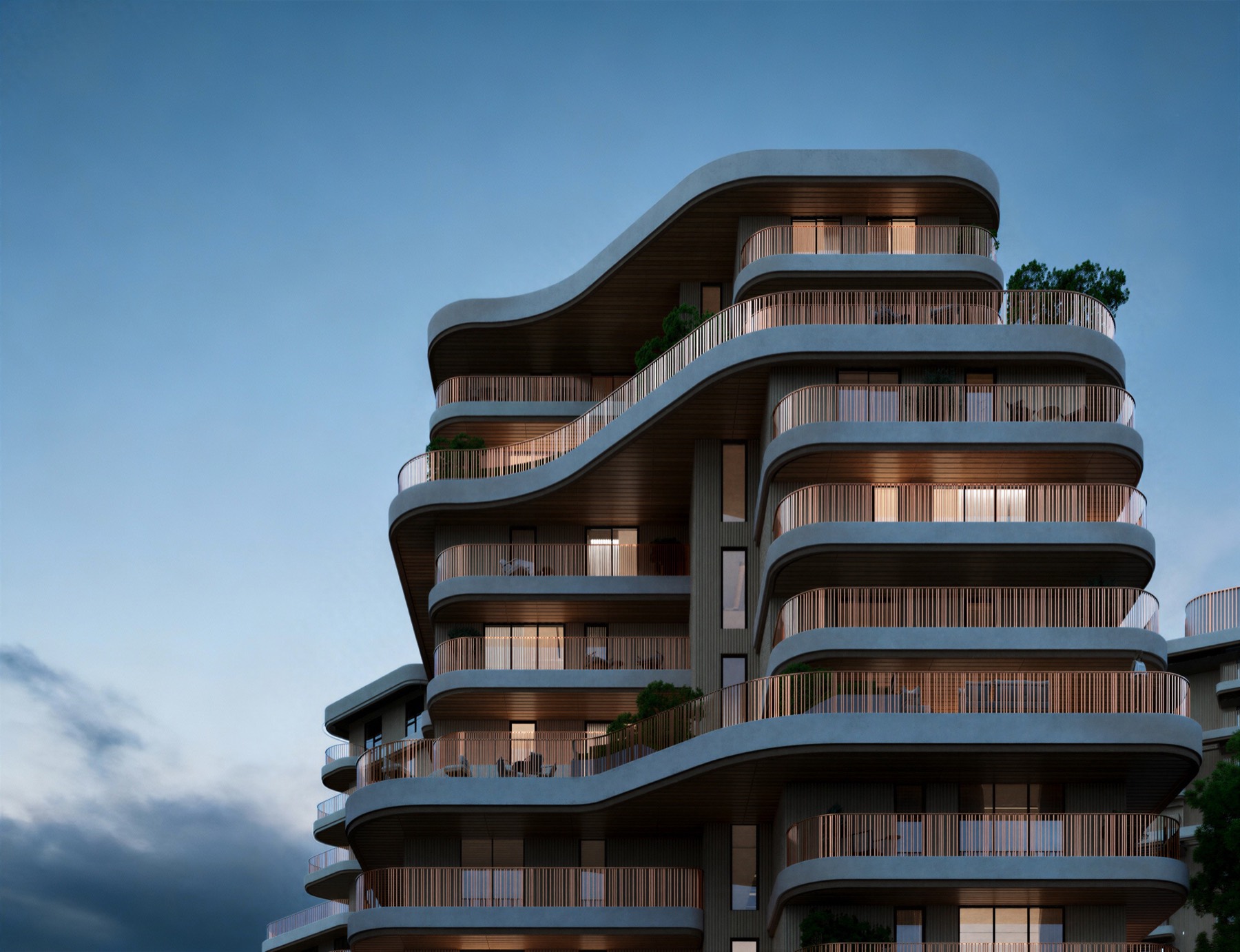 The residences at night, with warm light in the landscape.